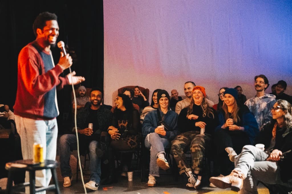 Stand-up comic with a laughing audience